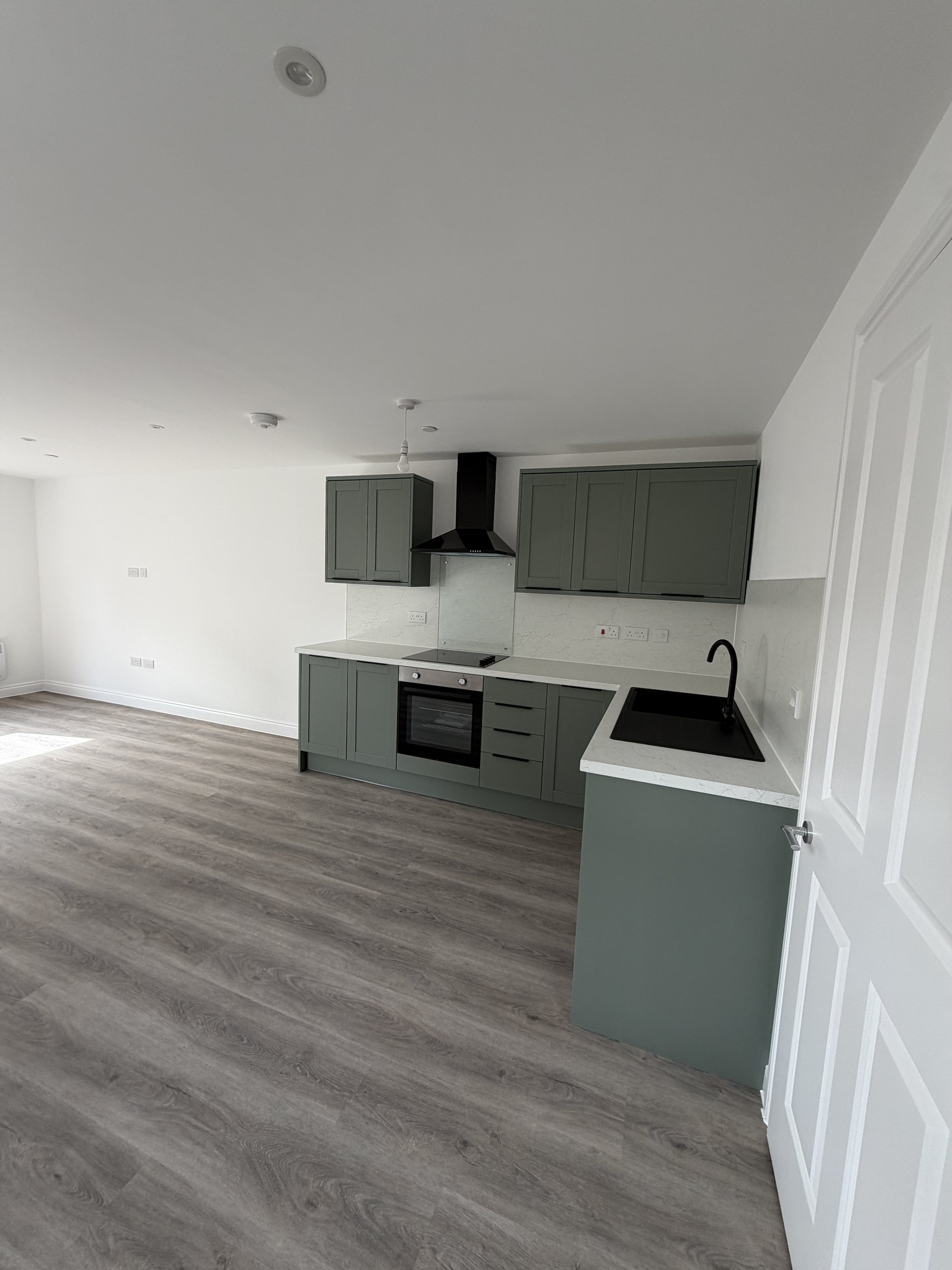 New kitchen, sage green units and quartz-effect worktops